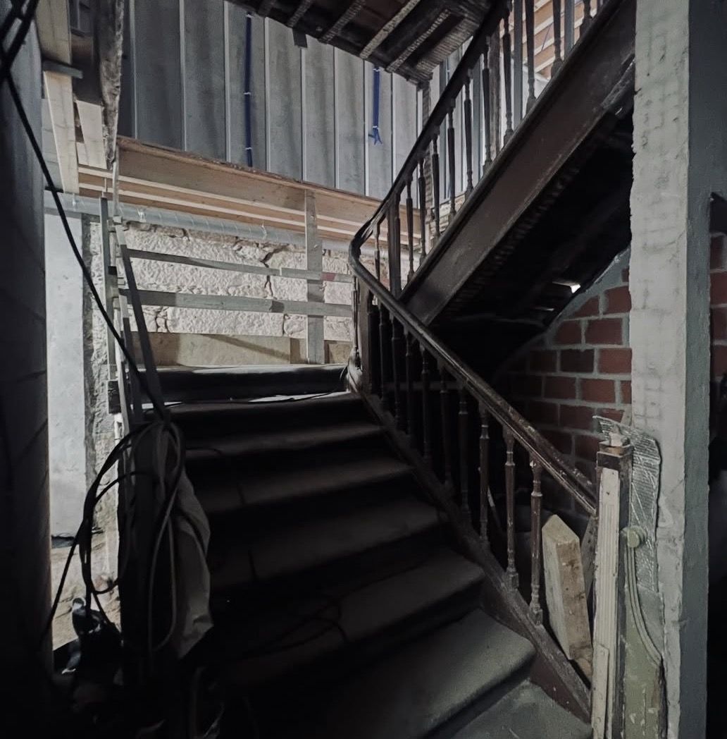 Original staircase mid-restoration in a Porto townhouse