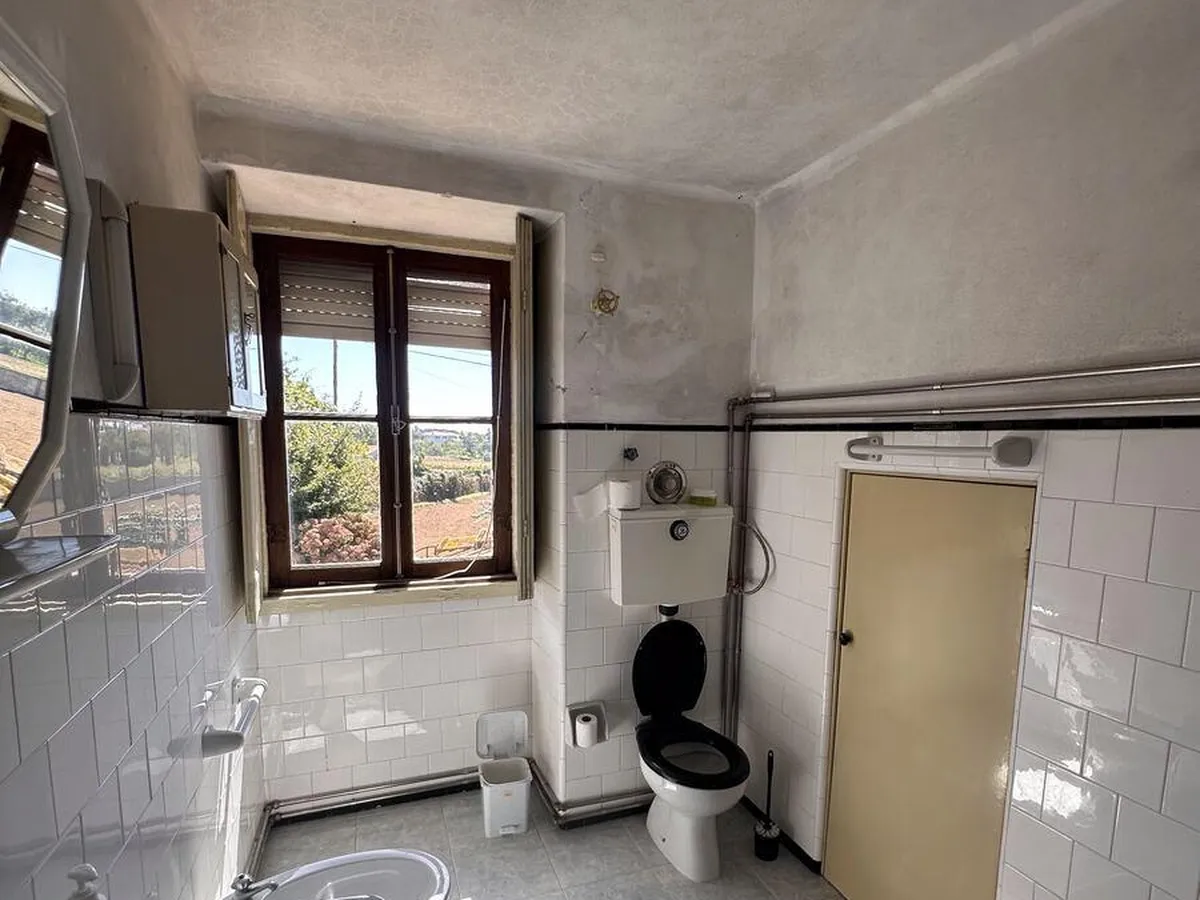 Black mould across a bathroom ceiling with no extract fan